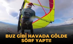 Buz gibi havada gölde sörf yaptı!