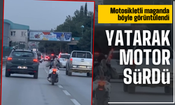 Trafikte tehlikeli anlar: Motosikleti yatarak kullandı