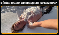 Soğuğa aldırmadan yarı çıplak şekilde kar banyosu yaptı