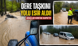 Dere taşkını yolu esir aldı, araçlar kontak kapattı