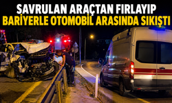 Savrulan Araçtan Fırlayıp Bariyerle Otomobil Arasında Sıkıştı