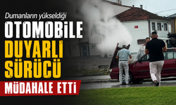 Dumanların yükseldiği otomobile duyarlı sürücü müdahale etti