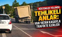 Rüstemler yolunda tehlikeli anlar: Yan yatan kasayla trafikte ilerledi