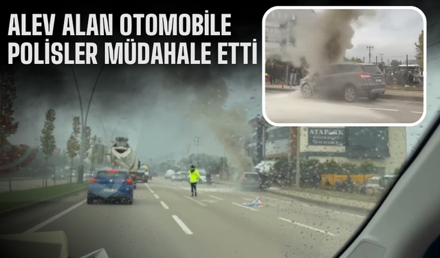 Alev alan otomobile polisler müdahale etti